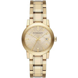 Close-up detail view of Burberry women's gold watch