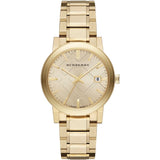 Side view of Burberry women's gold watch