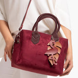 Ziva's Charm crossbody bag – side angle view (one versatile size)
