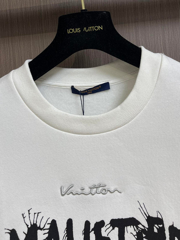 Close-up detail shot of Louis Vuitton luxury clothing with signature branding