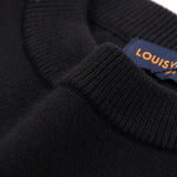 Back view of Louis Vuitton luxury clothing with tailored silhouette