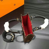 Front view of polished chic women's handbag – women's designer-style accessory