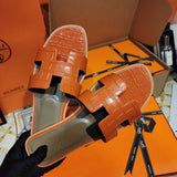 Hermès Black Slide Sandals - Angled View