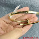 Side view of Cartier unisex jewelry piece