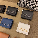  Refined crossbody bag carried on shoulder