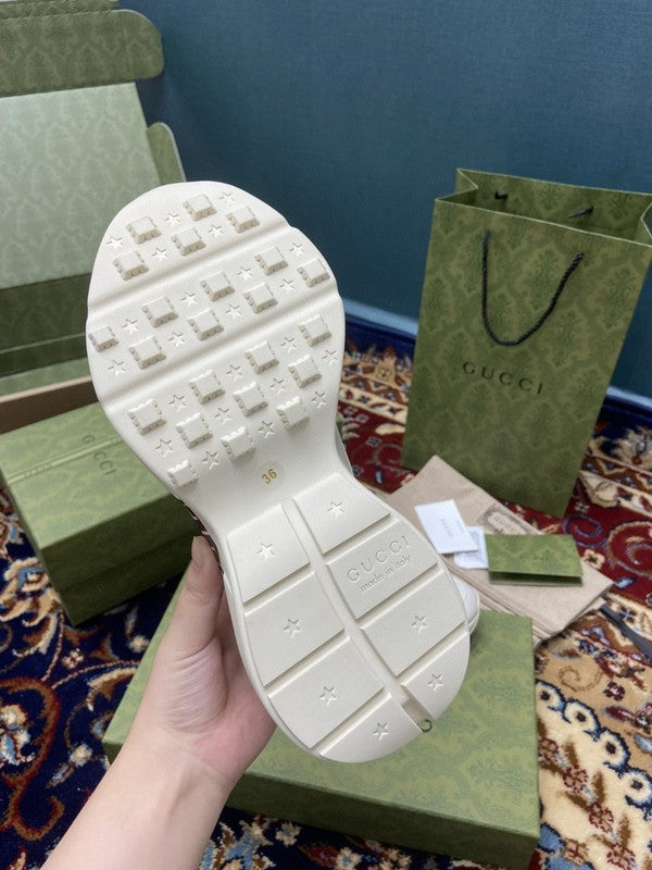 Side profile of Gucci neutral cream sneakers breathable knit upper