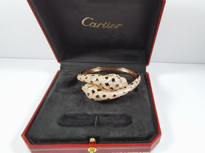 Close-up detail view of Cartier unisex jewelry piece
