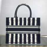 Side profile of modern statement women's handbag – women's luxury accessory