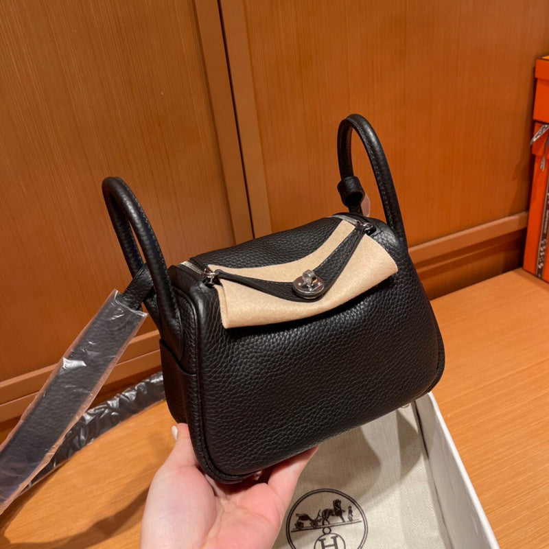 Side view of poised structured handbag