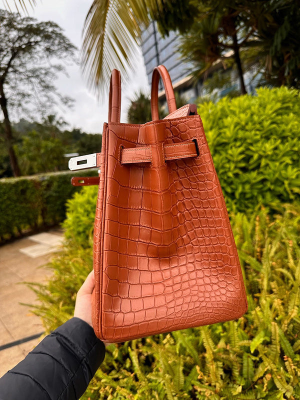 Side view of understated structured handbag