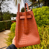 Side view of understated structured handbag