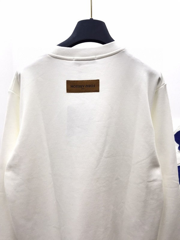 Back view of Louis Vuitton luxury clothing with runway-inspired design