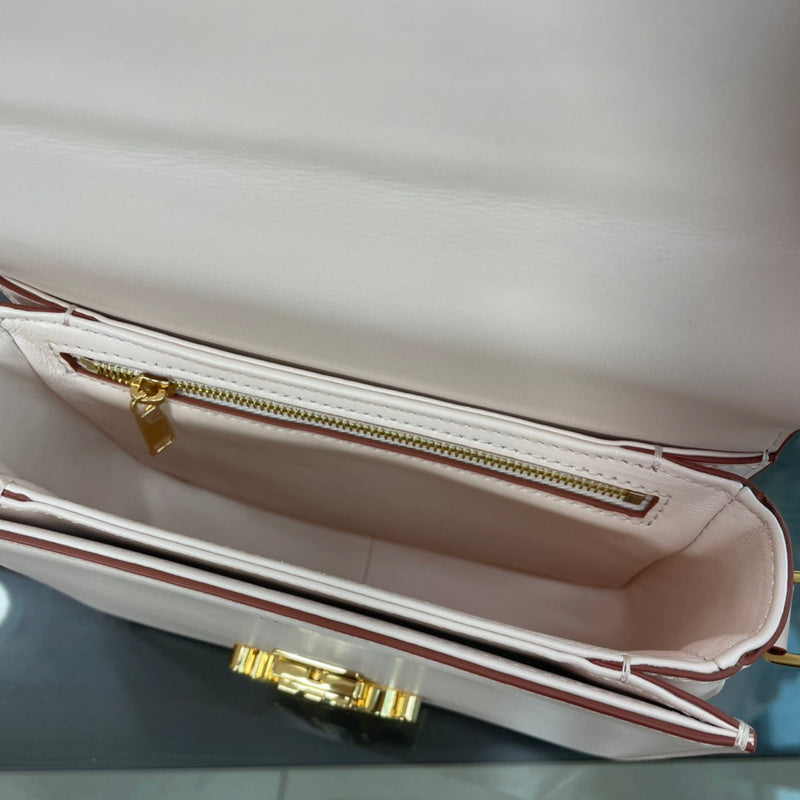 Handle and strap detail of chic structured women's handbag – women's designer-style accessory