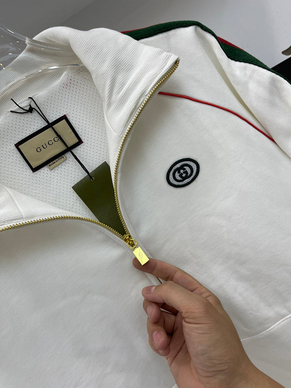 Close-up detail shot of Gucci luxury clothing with label-forward styling