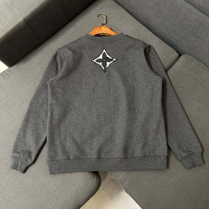 Side profile of Louis Vuitton luxury clothing with logo-detail design