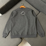 Side profile of Louis Vuitton luxury clothing with logo-detail design