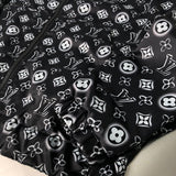 Full styled look of Louis Vuitton luxury clothing with tailored silhouette