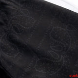 Close-up detail shot of Rhude luxury clothing with everyday silhouette