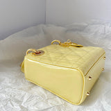 Side profile of structured signature women's handbag – women's designer-style accessory