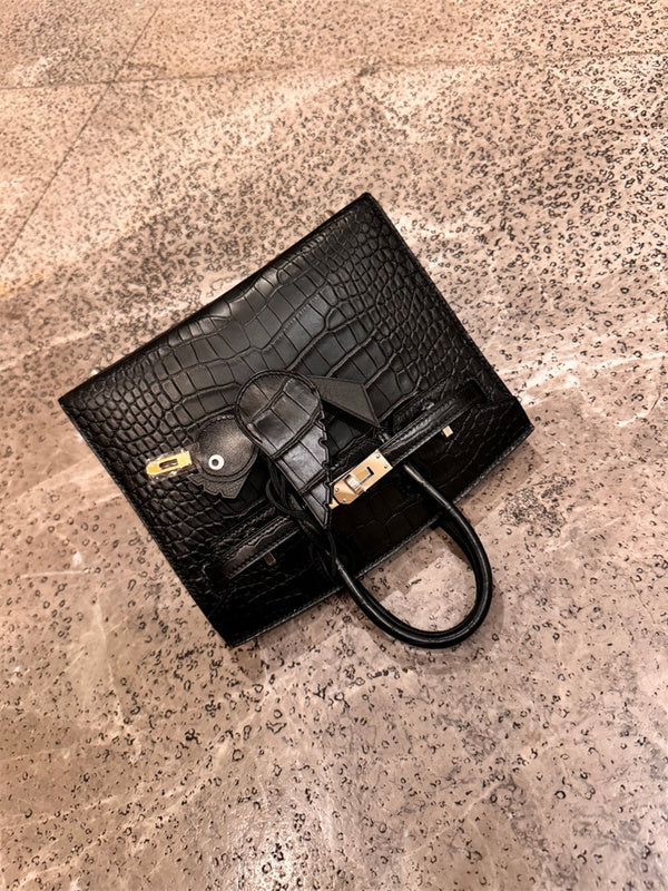  Tailored handbag carried on shoulder