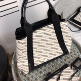 Handle and strap detail of chic classic women's handbag – women's designer-style accessory