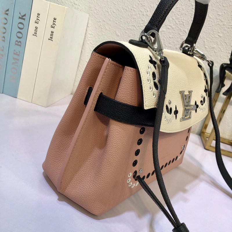Close-up detail of structured signature women's handbag – women's statement bag