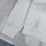 Flat lay presentation of Gucci luxury clothing with logo-detail design