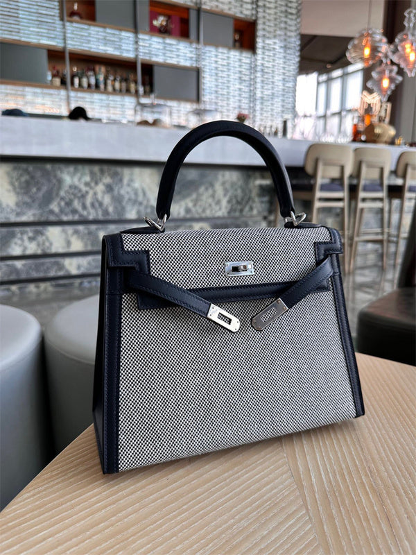  Signature crossbody bag carried on shoulder