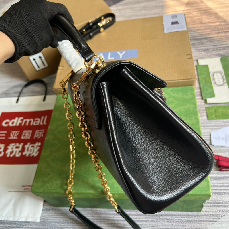 Handle and strap detail of polished refined women's handbag – women's designer-style accessory