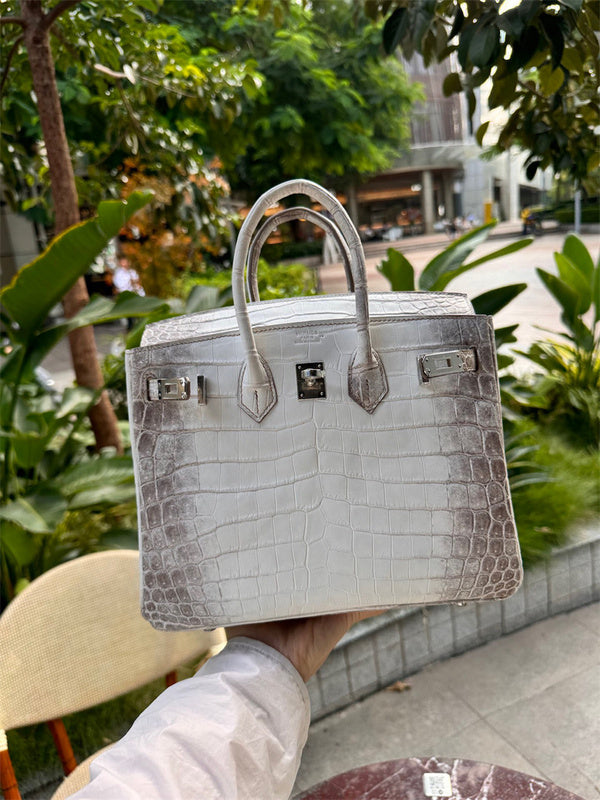  Chic top-handle bag carried on shoulder