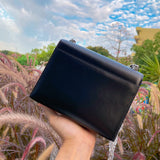 Side view of sophisticated structured handbag