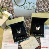 Lifestyle view of Van Cleef & Arpels unisex jewelry piece