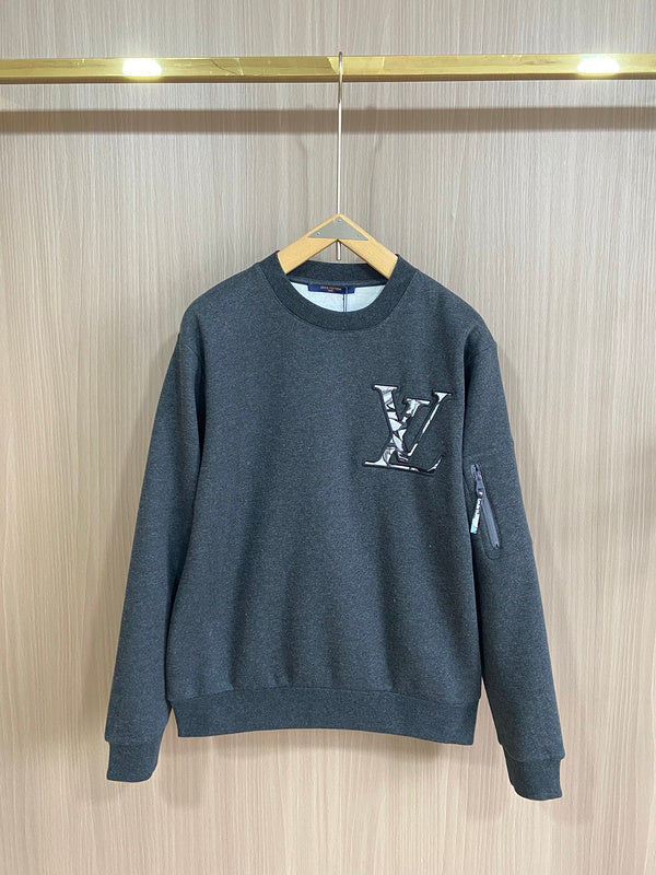 Back view of Louis Vuitton luxury clothing with label-forward styling