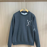 Back view of Louis Vuitton luxury clothing with label-forward styling