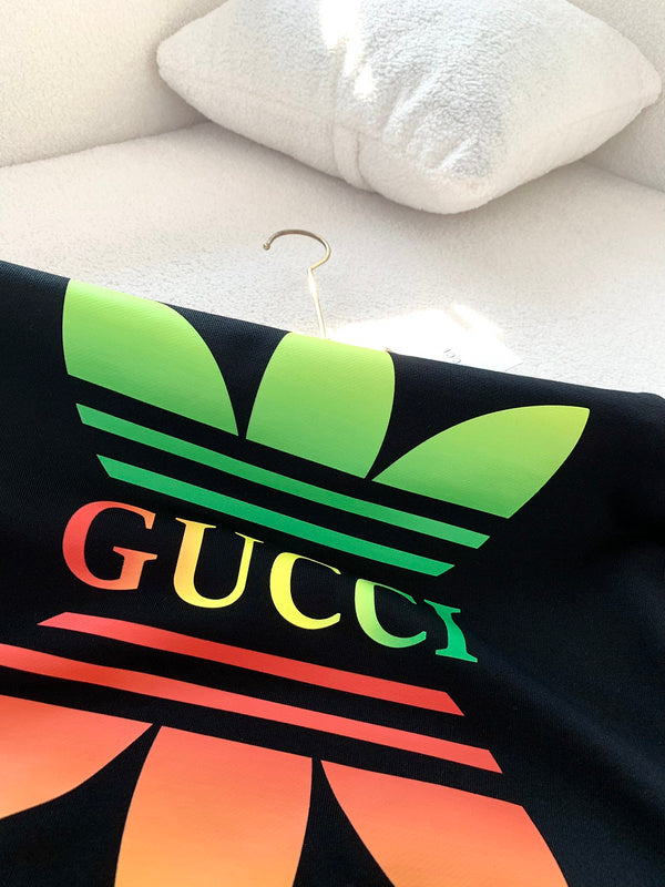 Side profile of Gucci luxury clothing with logo-detail design