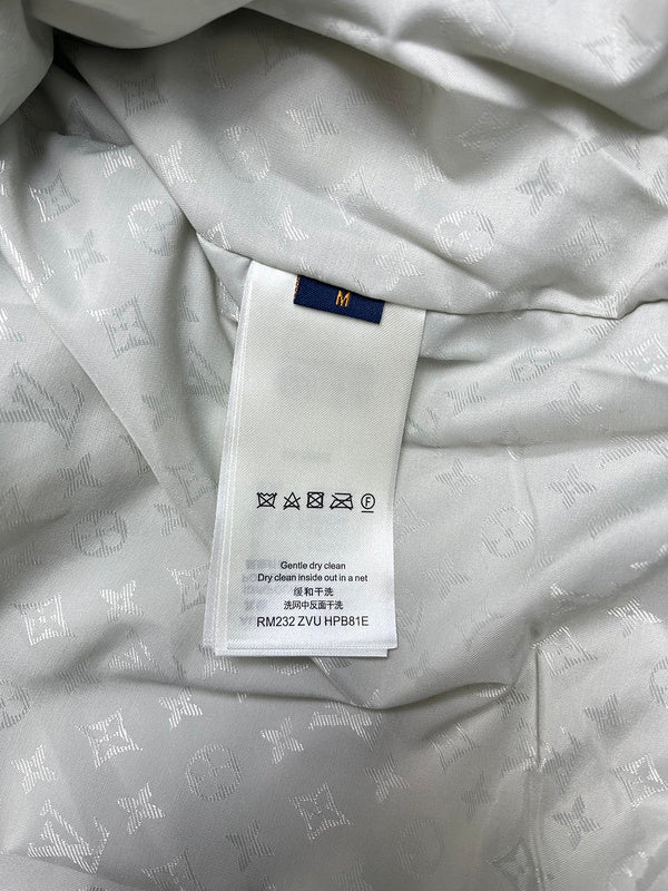 Close-up detail shot of Louis Vuitton luxury clothing with contemporary cut