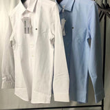 Side profile of Lacoste luxury clothing with monogram-inspired silhouette
