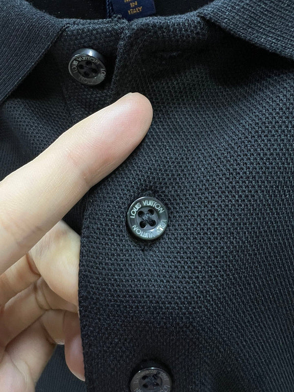 Full styled look of Louis Vuitton luxury clothing with label-forward styling