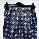 Close-up detail shot of Louis Vuitton cotton t-shirt with label-forward styling