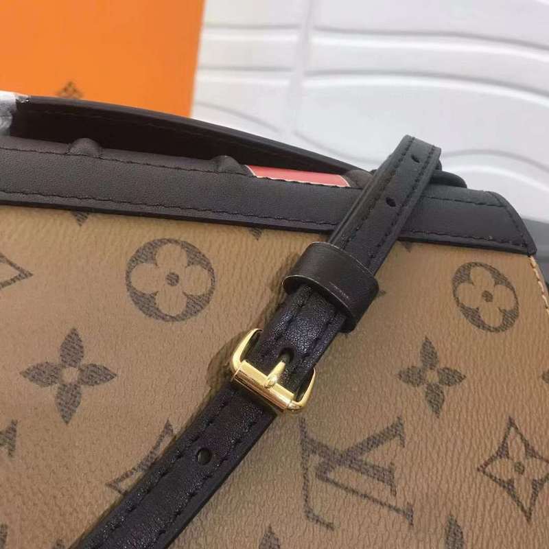 Handle and strap detail of signature polished women's handbag – women's everyday handbag