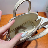 Poised bag shown from front angle