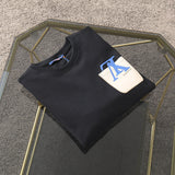 Close-up detail shot of Louis Vuitton luxury clothing with tailored silhouette