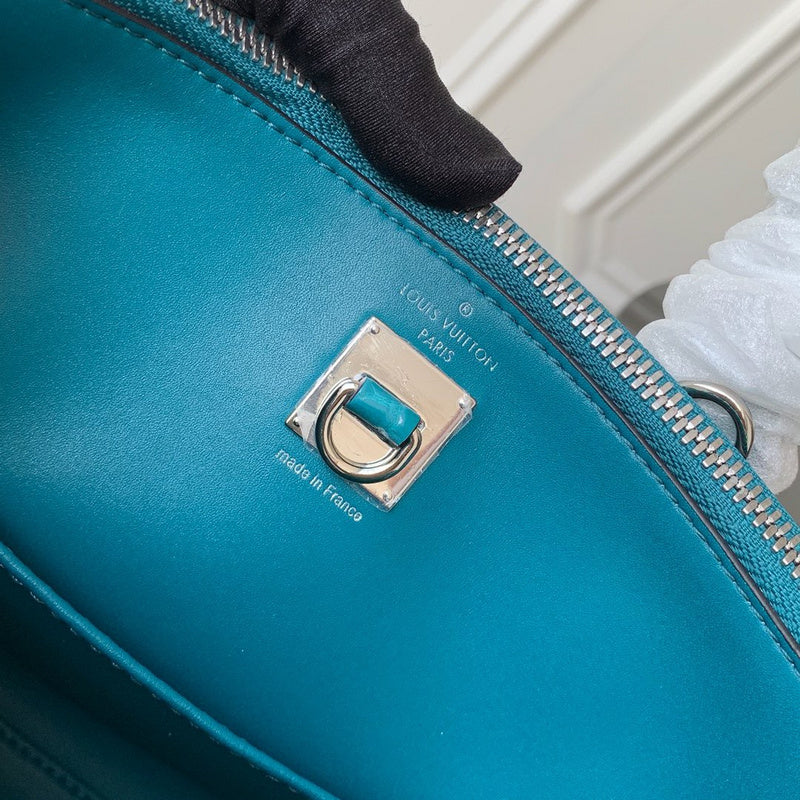 Side profile of modern polished women's handbag – women's statement bag