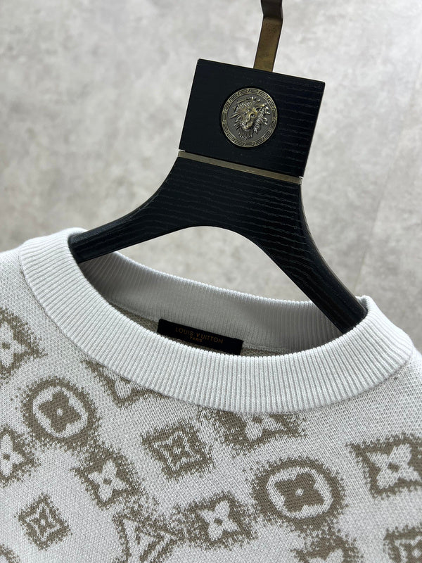 Close-up detail shot of Louis Vuitton luxury clothing with logo-detail design