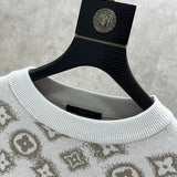 Close-up detail shot of Louis Vuitton luxury clothing with logo-detail design