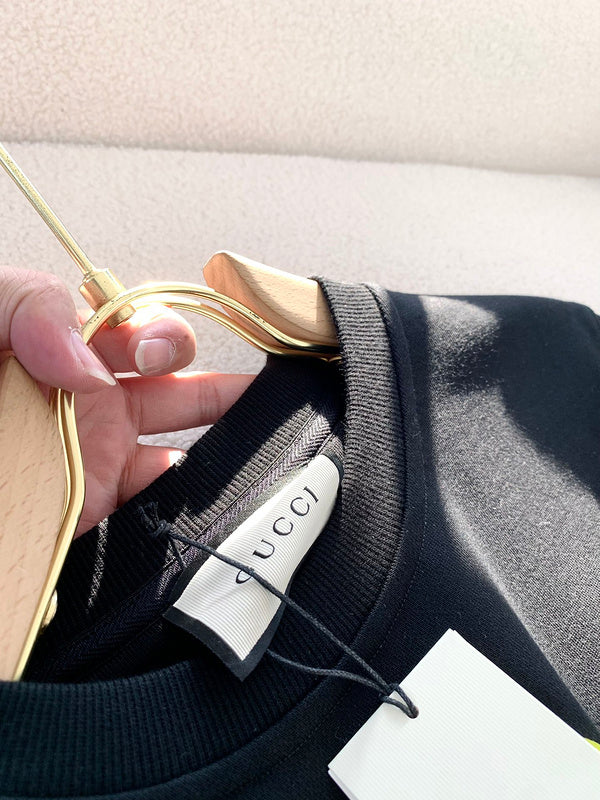 Back view of Gucci luxury clothing with logo-detail design