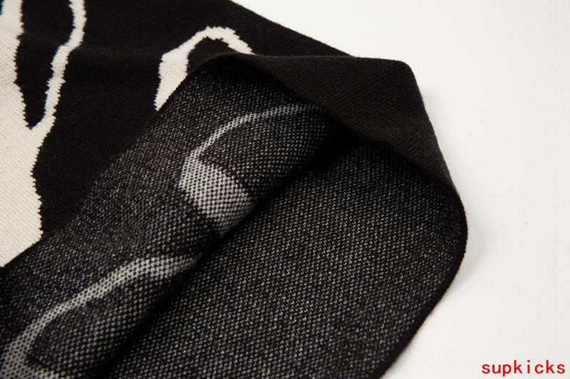Flat lay presentation of Rhude luxury clothing with runway-inspired design