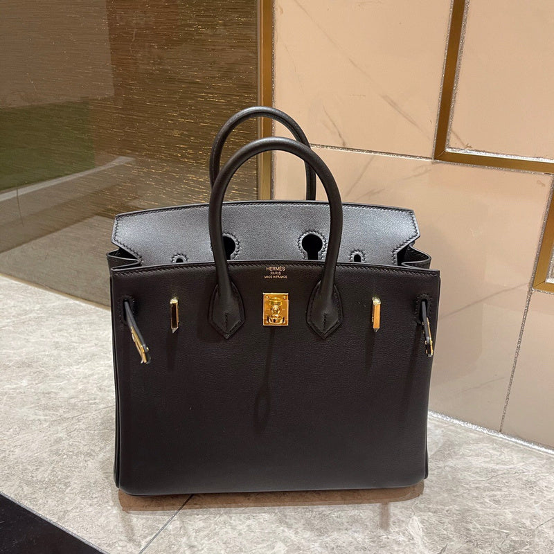 Side view of understated structured handbag