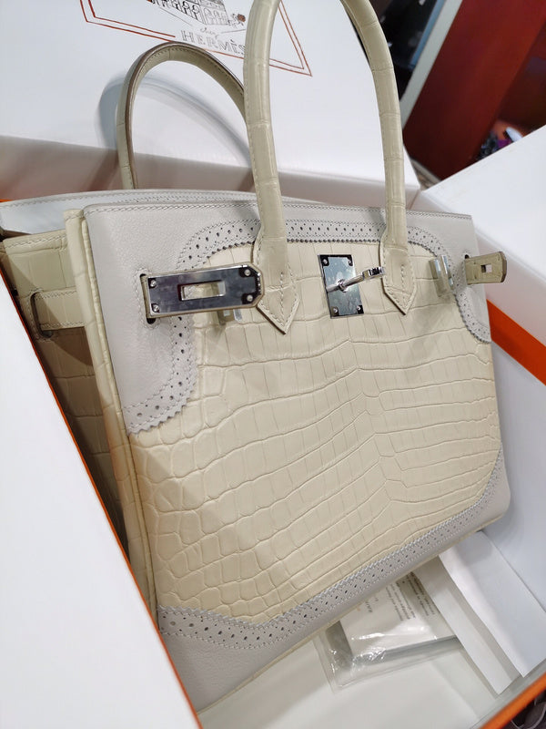 Side view of understated structured handbag