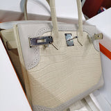 Side view of understated structured handbag